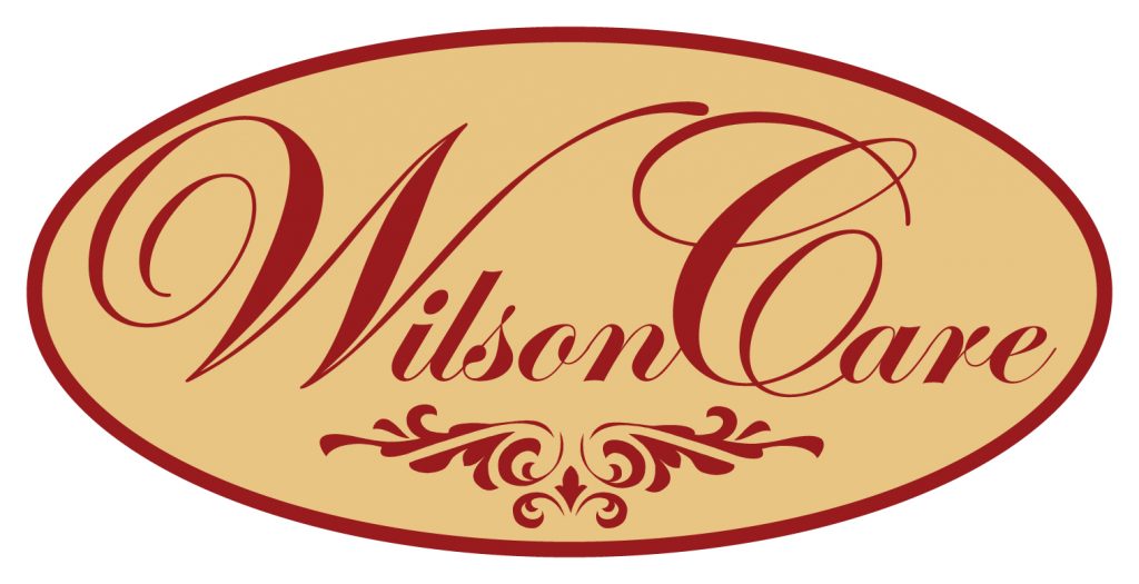 red and gold Wilson Care logo